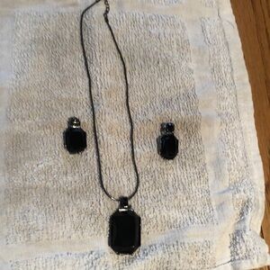 Black jewelry set containing necklace and matching earrings